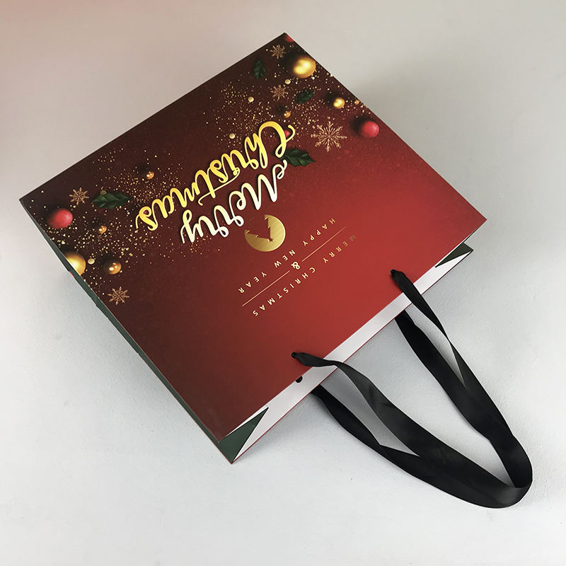 Bolsas de regalo de Navidad Bolsa de papel a granel con asas al por mayor y personalización